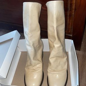 NWT slouchy leather boot featuring distressed details and a high stacked heel.